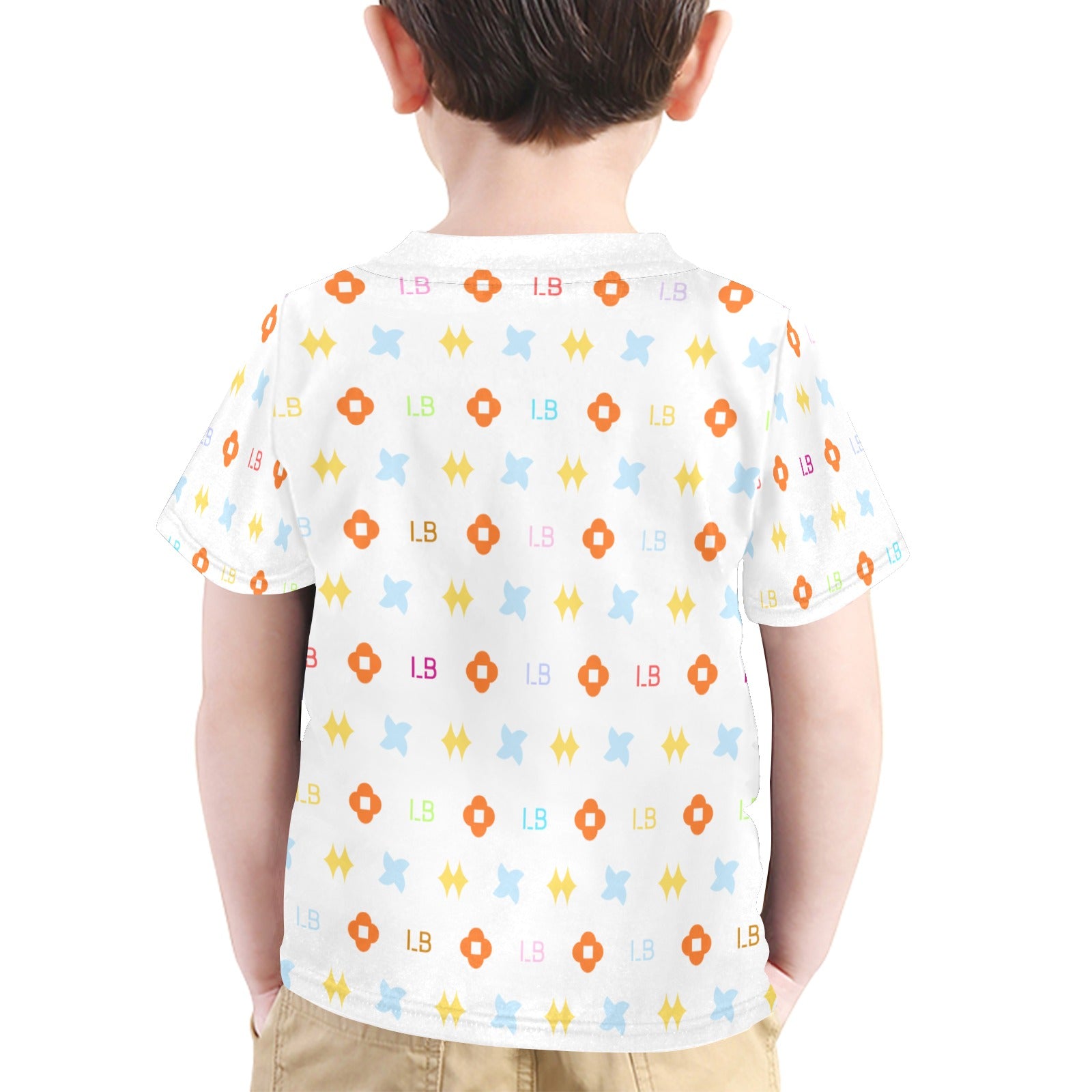 Boy in a white shirt with colorful geometric patterns, standing against a plain background.